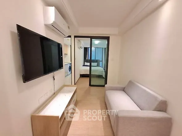 Modern apartment interior with cozy living room and bedroom view