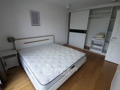 Spacious bedroom with modern design and built-in closet