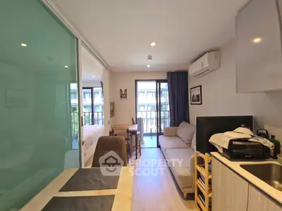 Modern open-plan living room with balcony in a stylish apartment