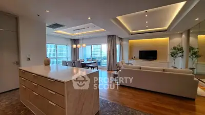 Luxurious open-plan living room with modern decor and city view, perfect for urban living.