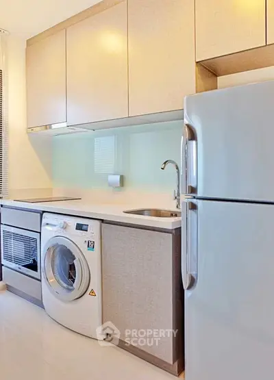 Modern kitchen with sleek appliances and ample storage space