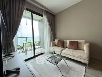 Modern living room with balcony view in high-rise apartment