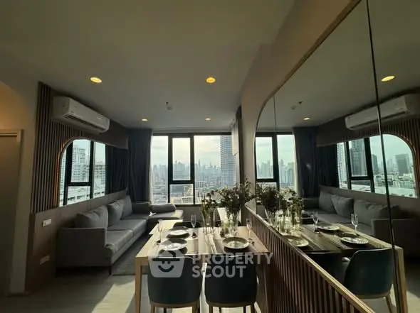 Modern living room with panoramic city view and elegant dining area