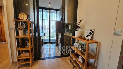 Chic modern kitchen with open layout and city view, featuring stylish wooden shelves and decor.