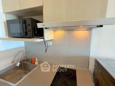 Modern kitchen with sleek appliances and stylish cabinetry