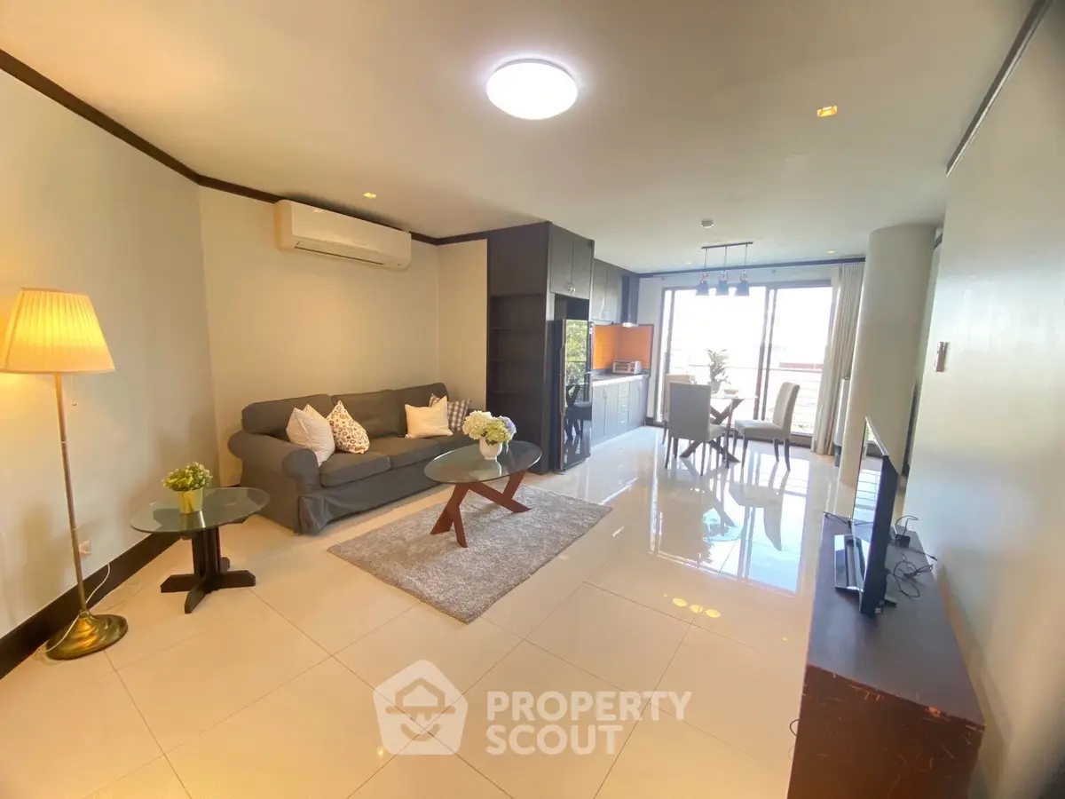 Spacious modern living room with elegant decor and ample natural light