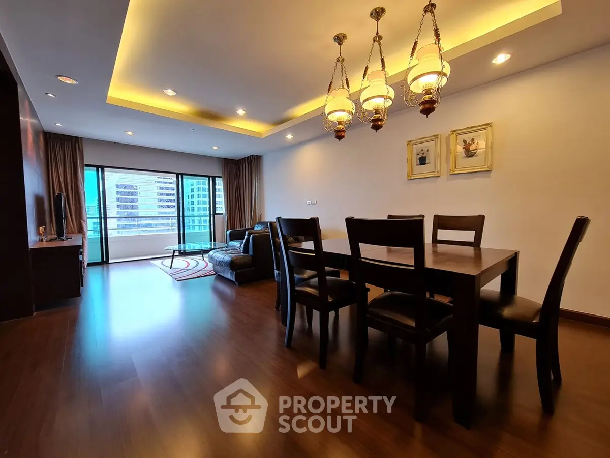 Spacious living room with elegant dining area and city view balcony in modern apartment.
