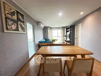 Spacious living room with modern decor and natural light in a stylish apartment.