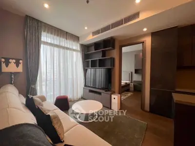 Modern living room with large window, stylish furniture, and open layout in a luxury apartment.