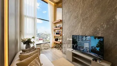 Luxurious living room with high ceilings and stunning city view, featuring modern decor and large windows.