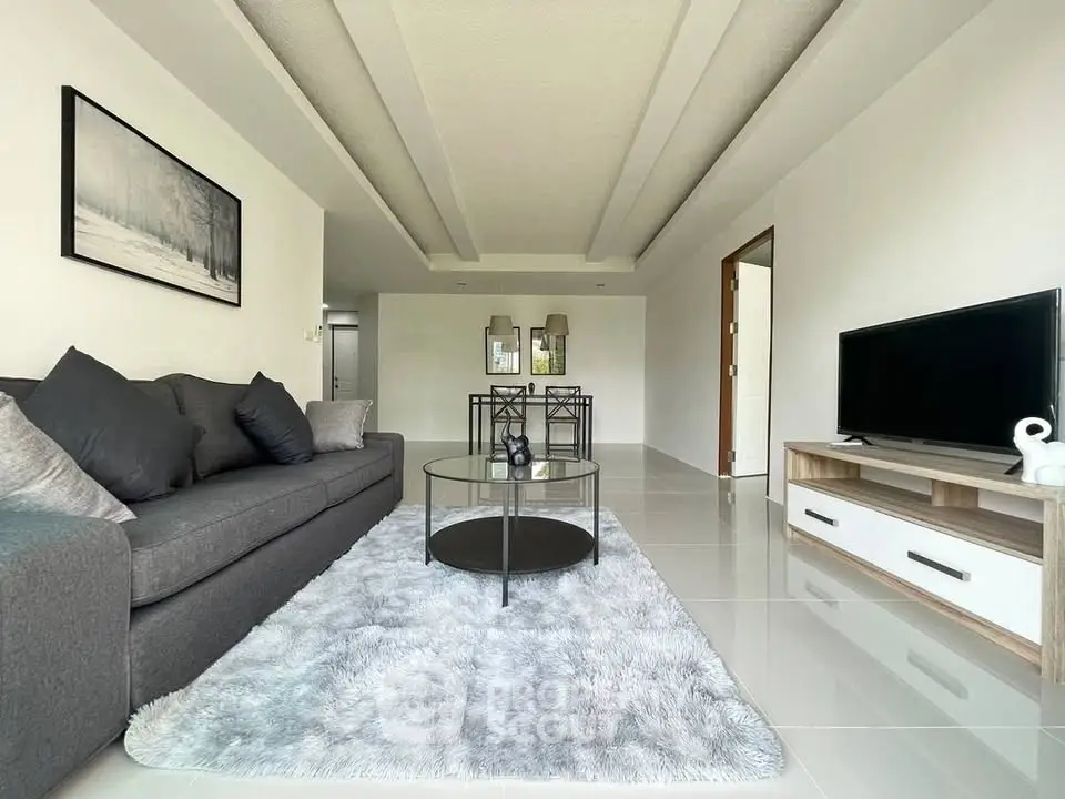 Spacious modern living room with sleek furniture and elegant decor