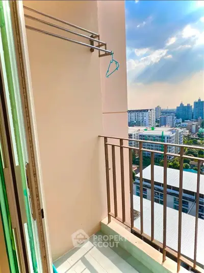 Charming balcony with city view, perfect for relaxation and enjoying the skyline.