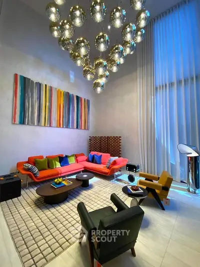Luxurious modern living room with high ceilings, vibrant decor, and elegant lighting.