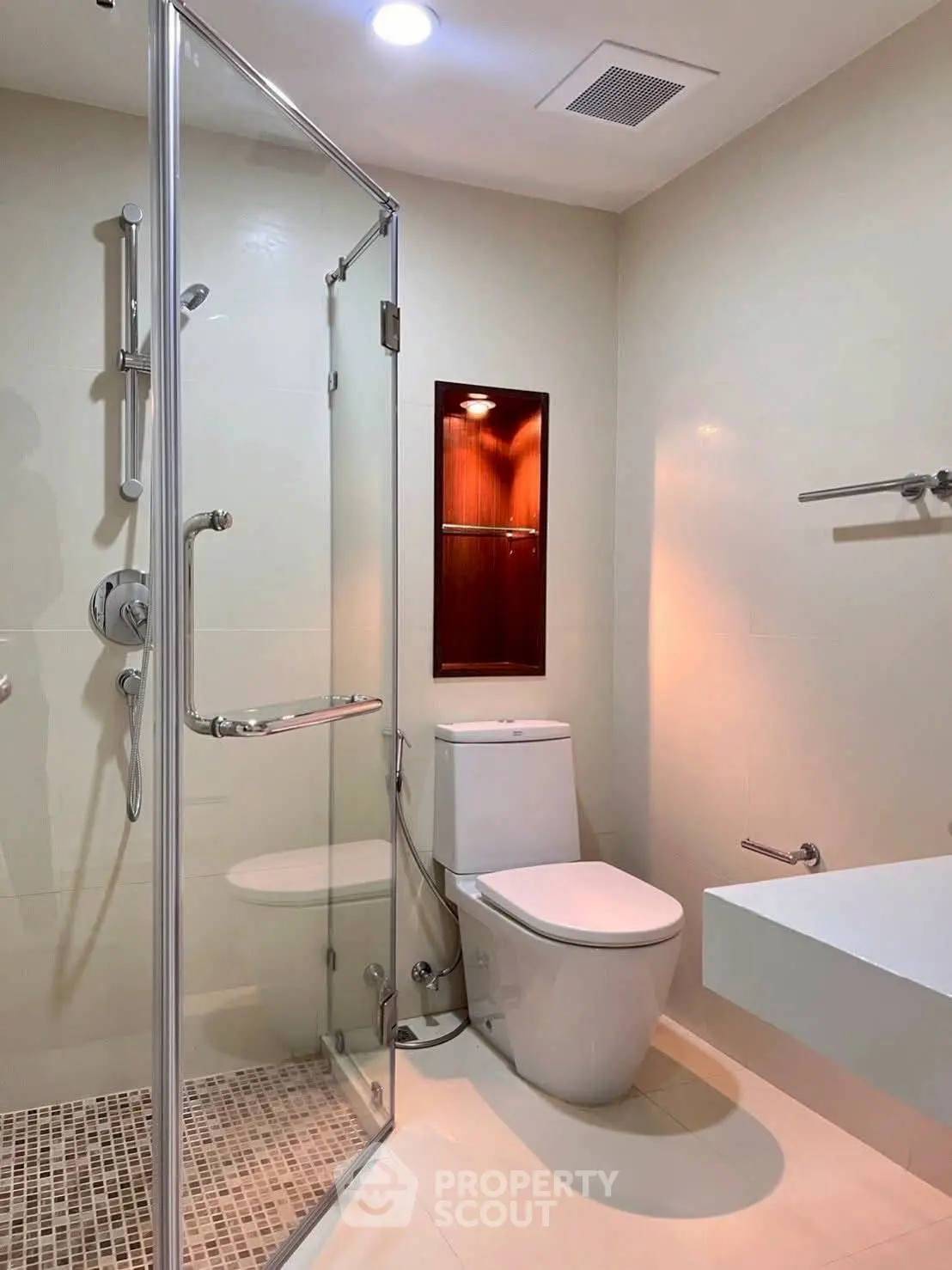 Modern bathroom with glass shower and sleek fixtures