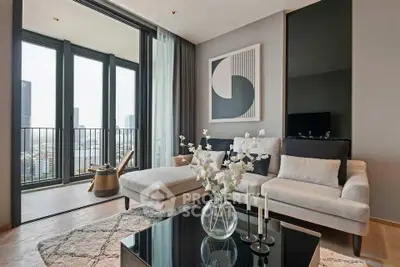 Modern living room with elegant decor and balcony view in a high-rise apartment.