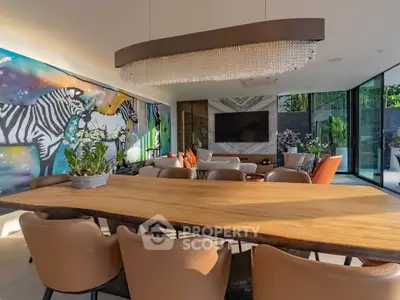 Luxurious modern living room with artistic zebra mural and elegant chandelier, perfect for stylish entertaining.