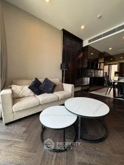 Modern living room with stylish furniture and open kitchen layout