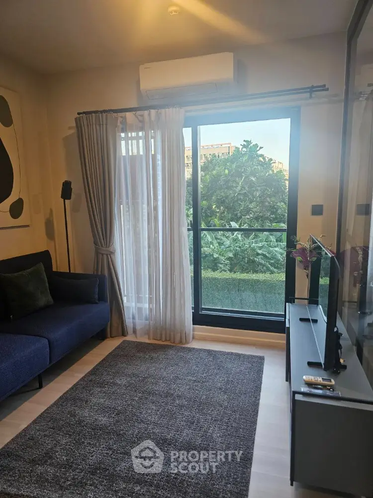 Modern living room with large window and stylish decor