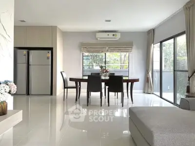 Spacious modern dining area with large windows and sleek furnishings