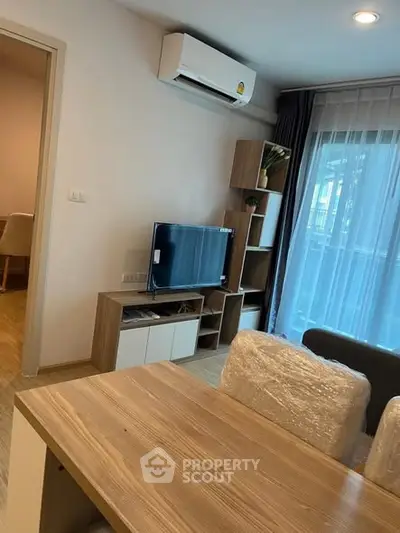 Modern living room with air conditioning and stylish furniture in a cozy apartment.