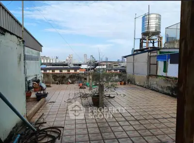 Spacious rooftop terrace with city views and potential for customization.