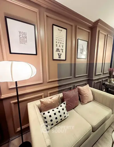 Stylish living room with elegant wall paneling and cozy sofa, perfect for modern urban living.