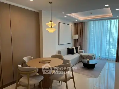 Modern living room with elegant dining area and floor-to-ceiling windows.
