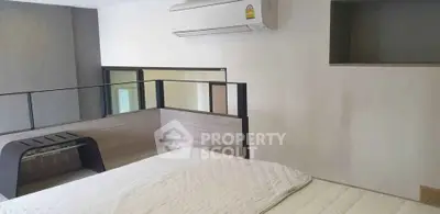 Modern bedroom with air conditioning and stylish decor in a contemporary apartment.