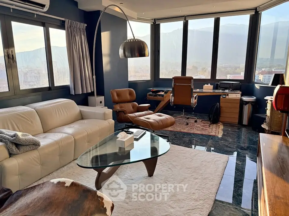 Luxurious living room with panoramic window views and modern furnishings