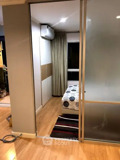 Cozy bedroom with sliding door and modern decor