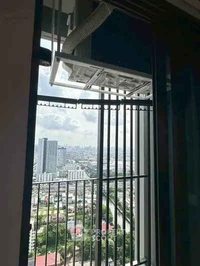 Stunning high-rise balcony view overlooking cityscape and skyline, perfect for urban living enthusiasts.