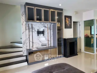 Modern living room with stylish marble wall and built-in storage
