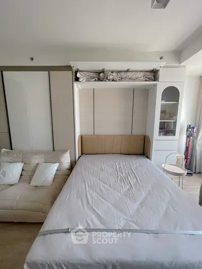 Modern bedroom with foldable bed and stylish storage solutions