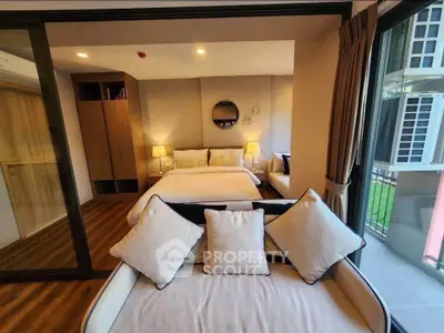 Luxurious bedroom with elegant decor and balcony view in modern apartment