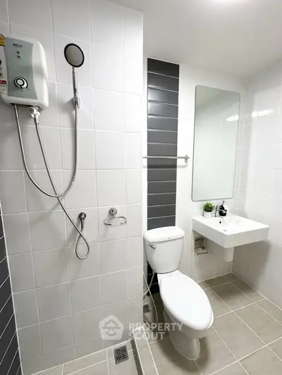 Modern bathroom with sleek design and shower amenities