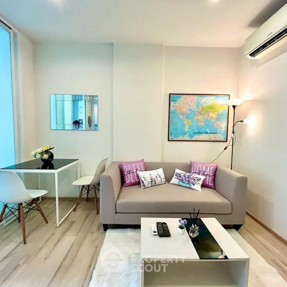 Modern living room with cozy sofa, stylish decor, and air conditioning