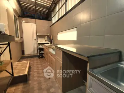 Modern kitchen with sleek countertops and ample storage space