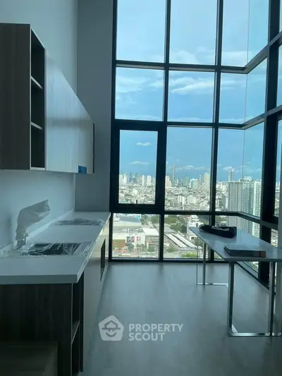 Modern kitchen with stunning city view and floor-to-ceiling windows
