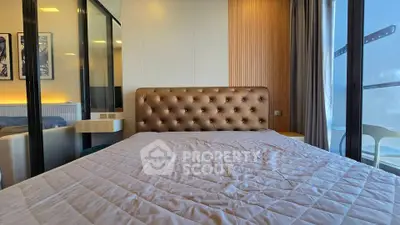 Luxurious bedroom with plush headboard and modern decor