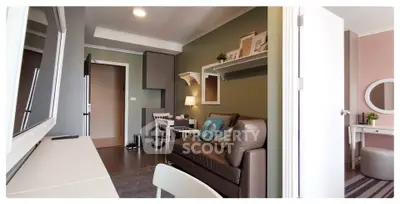Modern living room with stylish decor and cozy seating in a contemporary apartment.