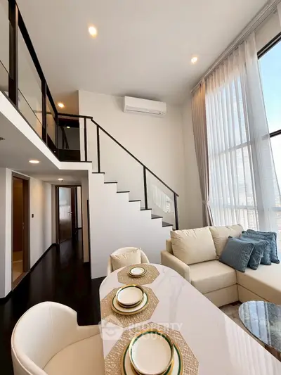 Luxurious modern living room with high ceilings and elegant decor