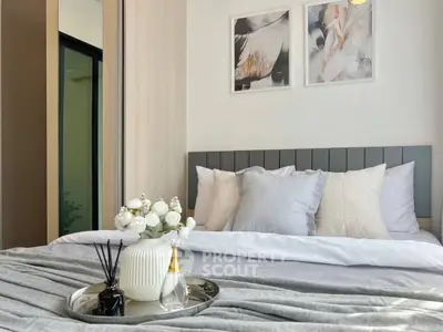 Elegant bedroom with modern decor and cozy bedding, perfect for relaxation and comfort.