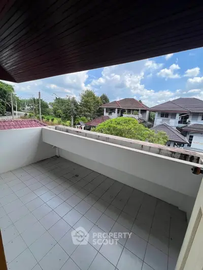 Spacious balcony with scenic neighborhood view, perfect for relaxation and outdoor enjoyment.