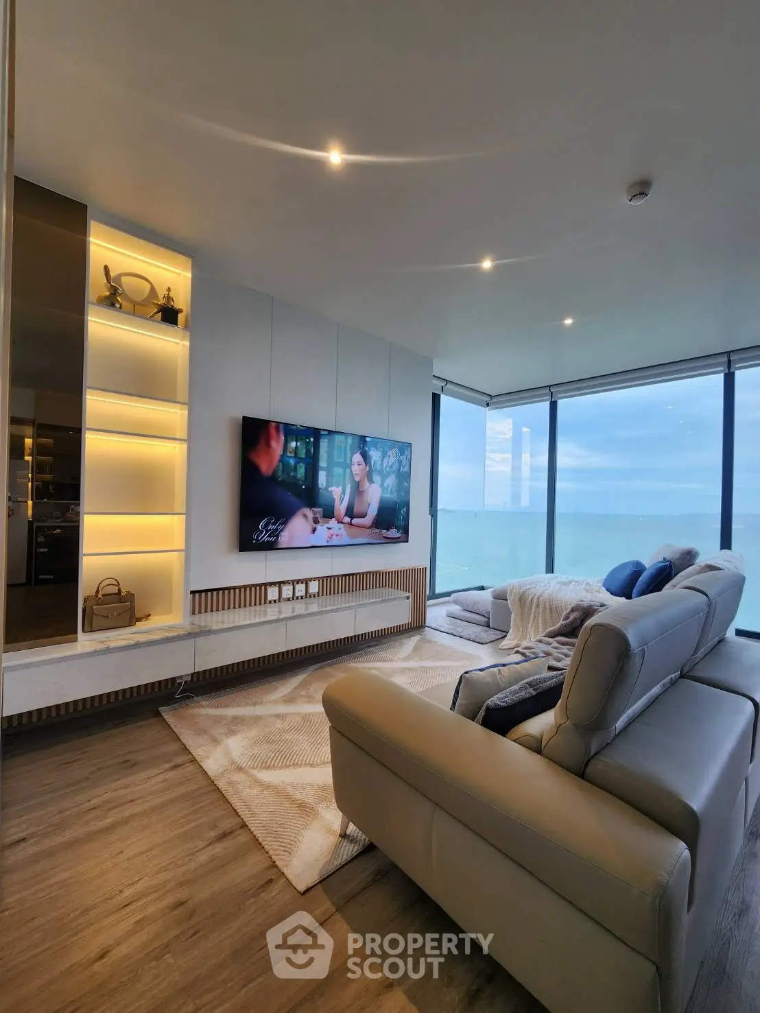 Luxurious living room with stunning ocean view and modern furnishings.