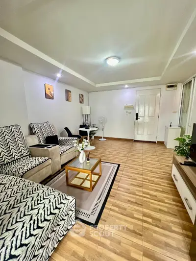 Spacious living room with stylish decor and modern furniture, perfect for relaxation and entertainment.