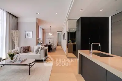 Luxurious open-plan living room with modern kitchen and elegant decor