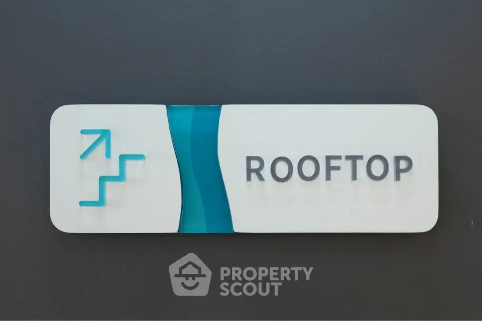 Modern rooftop access sign with sleek design and clear directions.