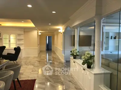 Luxurious open living space with elegant marble flooring and stylish decor