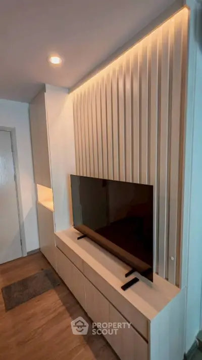 Modern living room with sleek TV unit and ambient lighting