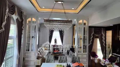 Luxurious living room with elegant chandelier and classic decor